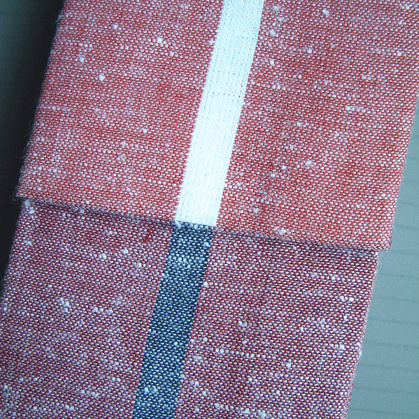 綿紬鈍いピンクの白1本縞の子供半纏帯